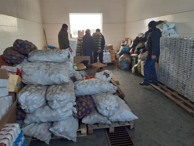 People in Ukraine prepare food and supplies for those in need